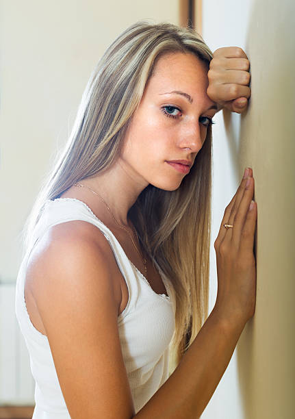 istock Blonde unhappy woman at home 533834773