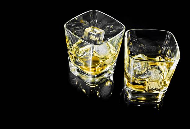 istock two glasses of whiskey alcoholic drink with ice 533835174
