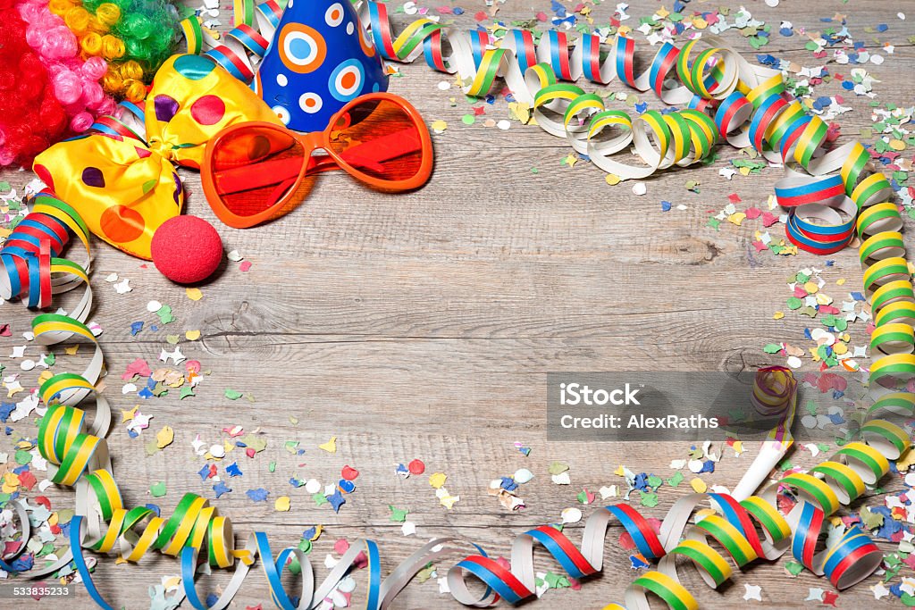 Colorful carnival background Colorful carnival background with garlands, streamer, party hats, confetti and mask 2015 Stock Photo