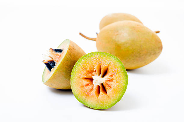 istock Fresh sapodillas isolated on white background 533836805