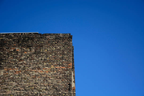 istock Old brick wall on a background of blue sky 533837087