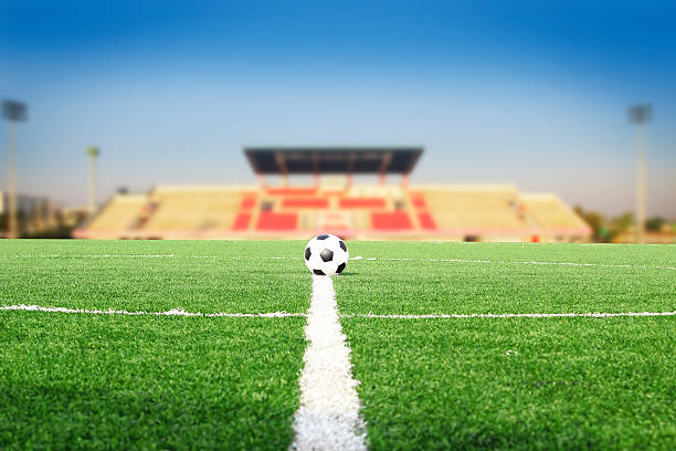 istock Soccer ball on field in stadium 533837173