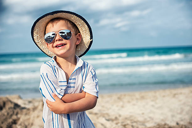 Beach portrait of a laughing little boy