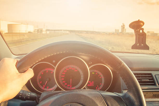 istock Driver's hands on steering wheel inside of a car 533838326