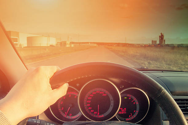 istock Driver's hands on steering wheel inside of a car 533838582