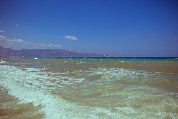 Beautiful wave on sea and blue sky with clouds as background