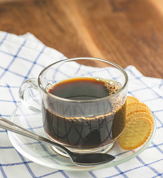 Thin biscuit and black coffee stock photo