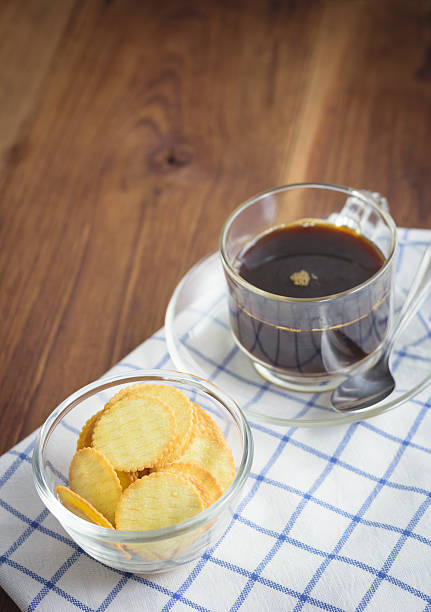 Thin biscuit and black coffee stock photo