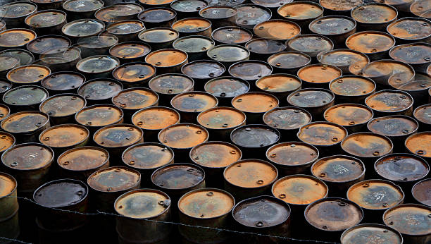 istock Stacks of old oil tanks making a background 533841644