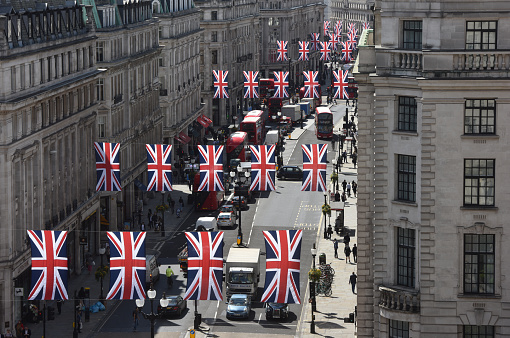 London, UK - May 24th 2016:British flags strewn over Regent Street in central London's retail area to celebrate the Queen's birthday