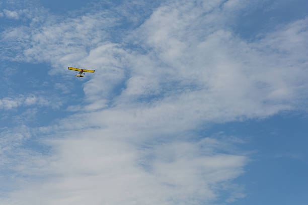 istock Small yellow plane in the sky 533845140