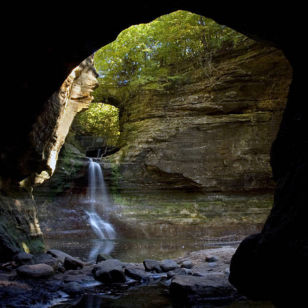 Cave and Waterfall into Lake at Matthiessen, Illinois stock photo