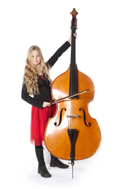 istock young girl plays double bass in studio 533846605