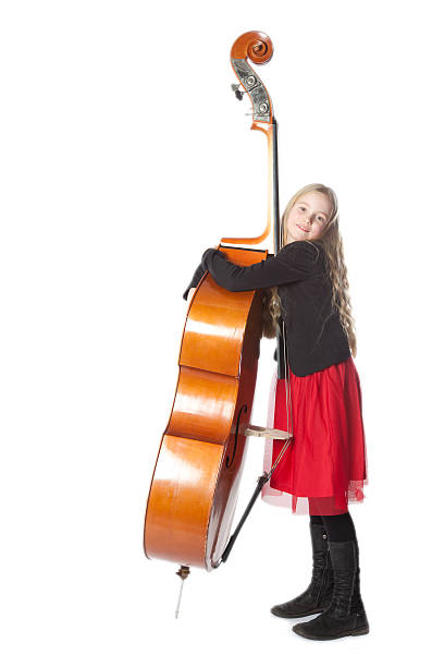 istock young girl embraces double bass in studio 533846621
