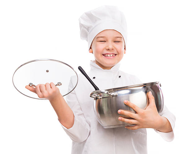 istock laughing little boy-cook with pan in hands 533847918