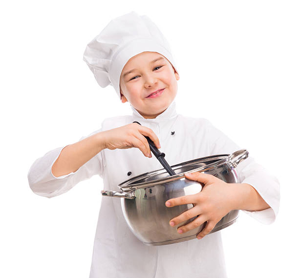 istock laughing little boy-cook with pan in hands 533847940