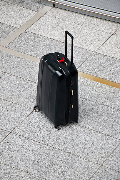 Suspicious Unattended Suitcase stock photo