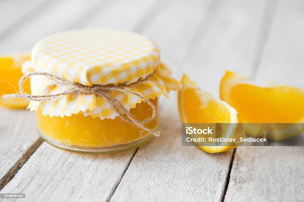 Orange marmalade on white table Homemade orange marmalade on white wooden table 2015 Stock Photo