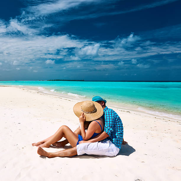 istock Couple in blue on a beach at Maldives 533848913