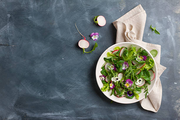 istock Spring salad with radishes, edible flower and sauce 533849078