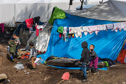 Idomeni, Greece.  - March 17, 2016: Boys play near their tents on March 17, 2015 in the refugee camp of Idomeni. 