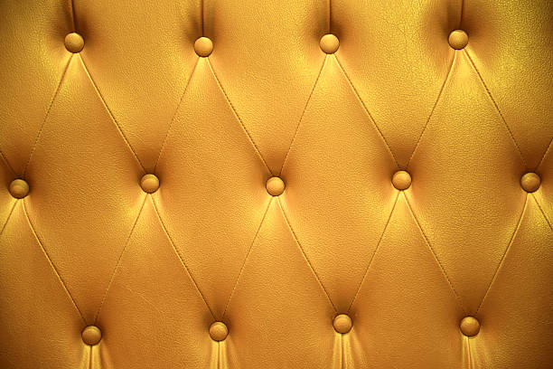 istock Closeup texture of vintage yellow leather sofa for background 533849746