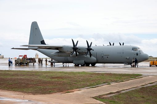 Rairok, Majuro Atoll, Republic of the Marshall Islands: US Marine Corps (USMC) Gulfstream C-20G (registration 165152, MSN 1201) and Air Marshall Islands DHC-8-100  (registration V7-0210, MSN 218) on the apron - Marshall Islands International Airport / Amata Kabua International Airport / Majuro Airport.