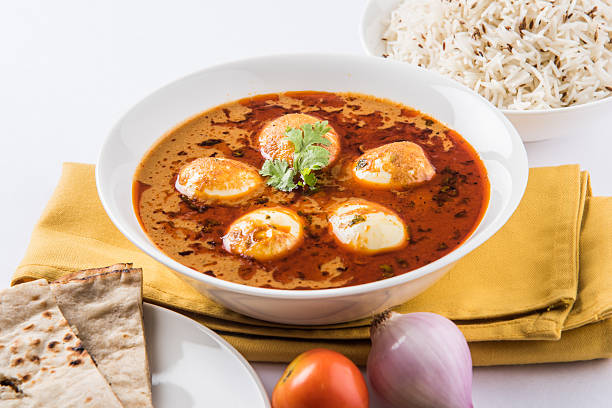 istock spicy anda curry or egg curry with roti and rice 533851098