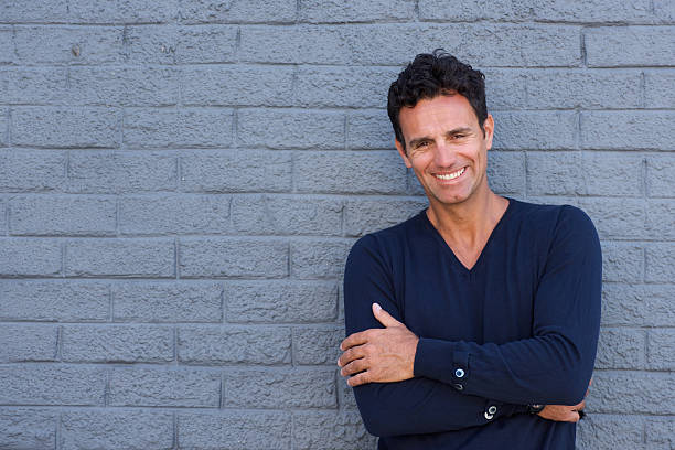 istock Smiling older guy with arms crossed 533852152