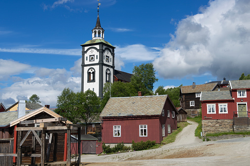 Traditional houses and church bell tower exterior of the copper mines town of Roros, Norway. Roros is declared a UNESCO World Heritage site.