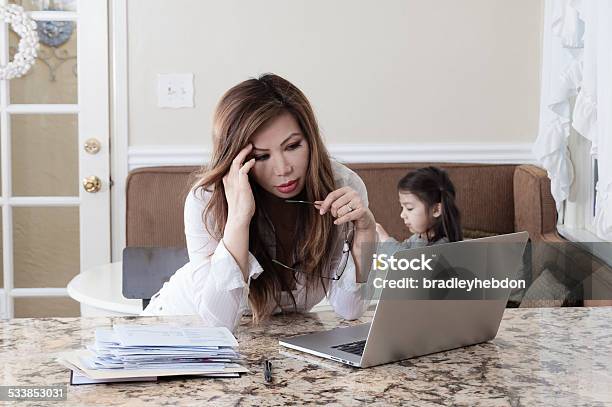 Worried Single Mother Under Financial Strain Stock Photo - Download Image Now - Distraught, Juggling, Mother