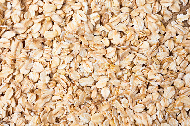 istock Raw oats wooden cutting board  background. 533853132