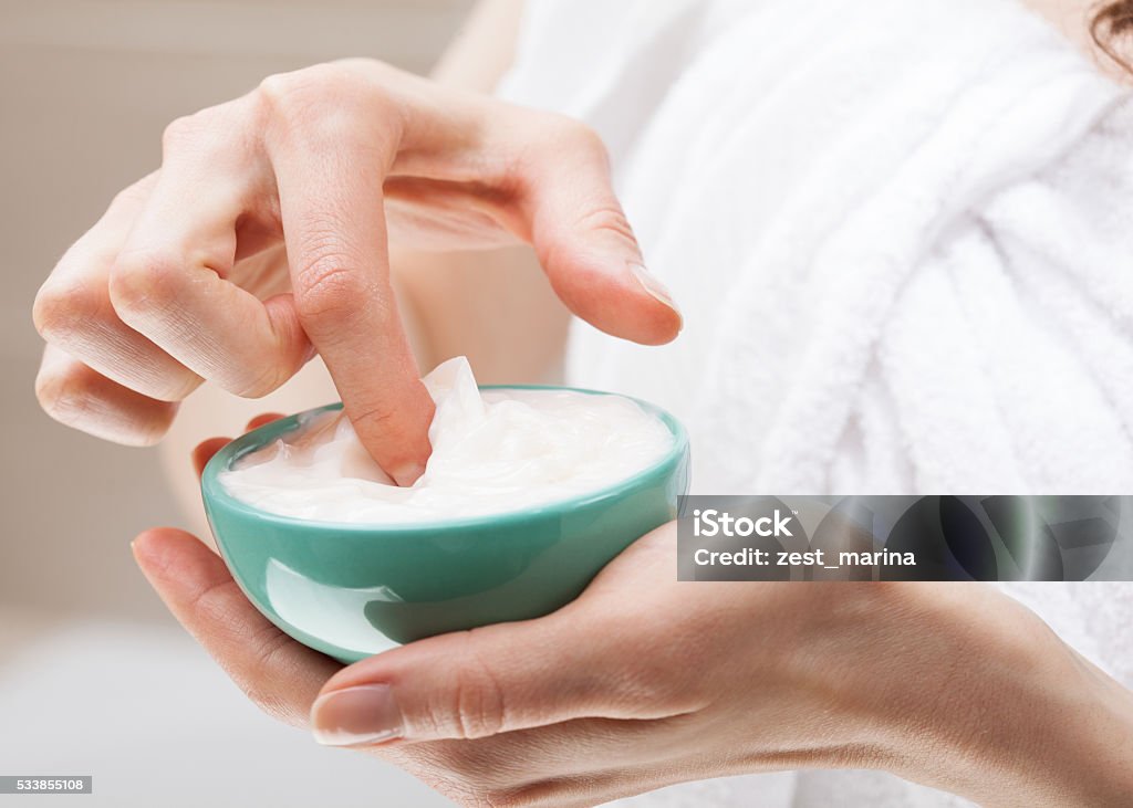 Woman holding bowl with nourishing mask Closeup of woman hands holding bowl with nourishing mask; skincare and haircare concept Fingernail Stock Photo