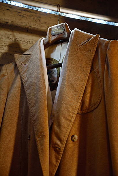 istock bespoke coats and jackets Men's hanging 533855802