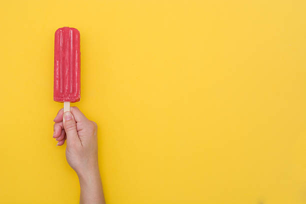 Strawberry popsicle in hand