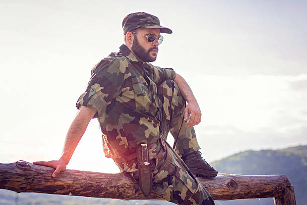 istock Young military man scouting around in forest 533856722