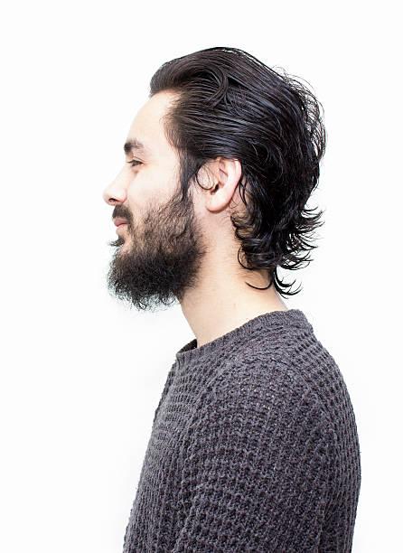 istock Profile view of smiling young man over white background 533857048