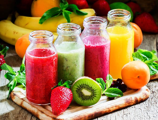 istock Several bottles with fruit and berry juices 533857114