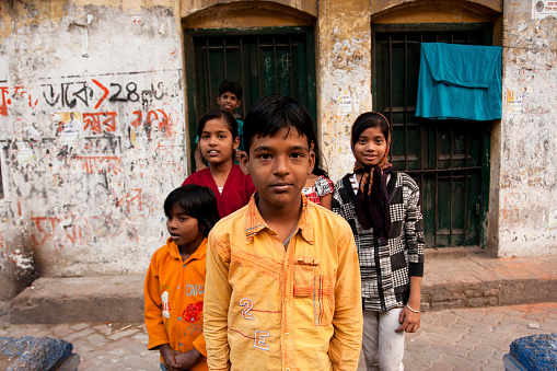 Kolkata, India - January 14, 2013: Unidentified children pose outdoor after school classes on January 17, 2013 in Kolkata, India. Kolkata's literacy rate of 87.14 perc. exceeds the all-India average of 74 perc.