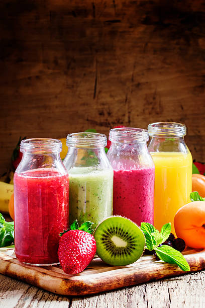istock Several bottles with fruit and berry juices 533857606
