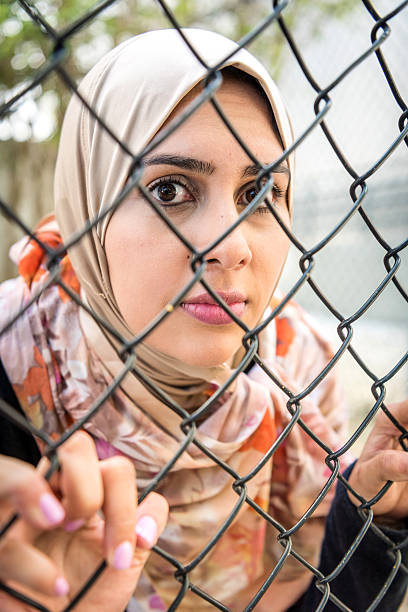 istock Sad refugee Middle eastern woman (Real People) 533861604