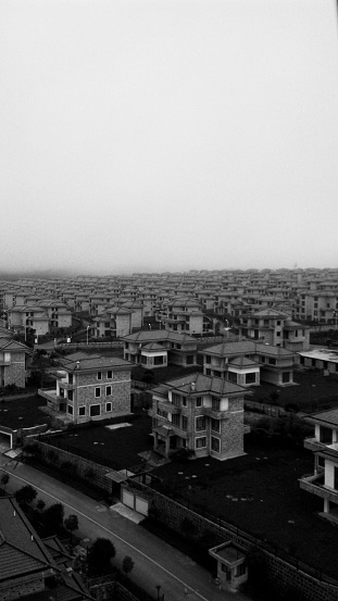 Tengchong, Yunnan, China - August 20th, 2014: general view of the clonned housing pieces of a new residential extrension area in the outskirts of Tengchong city, in Yunnan province. 