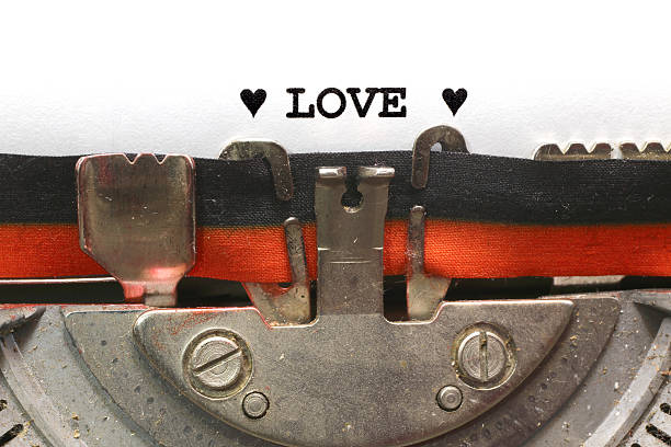 istock written typewriter LOVE with black ink 533873801