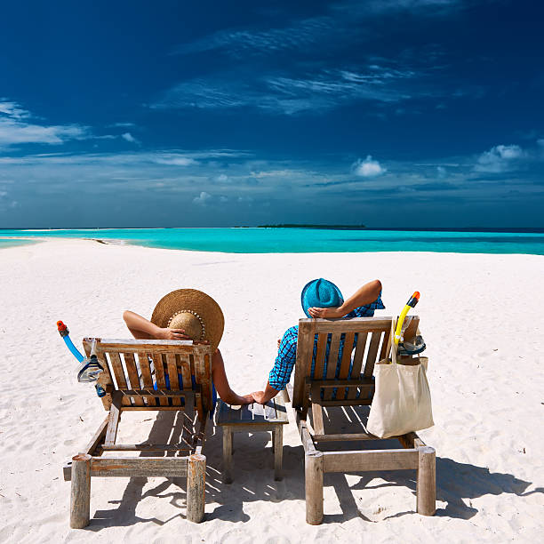 istock Couple relax on a beach at Maldives 533874201