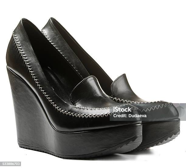 Pair Of Black Leather Shoes On A High Platform Sole Stock Photo - Download Image Now
