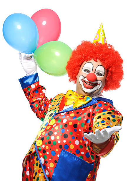 Clown Portrait of a smiling clown with balloons isolated on white circus clown carnival harlequin stock pictures, royalty-free photos & images