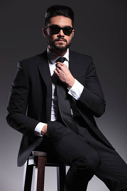 istock Young business man fixing his tie 533888565