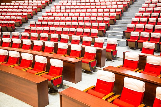 istock performance venue red seats, no one around. 533888857