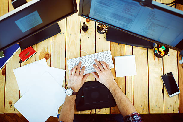 istock Young man in home office typing 533889617