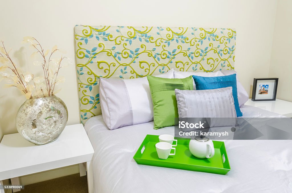 Bedroom Modern bedroom interior in a luxury house with bed and pillows 2015 Stock Photo